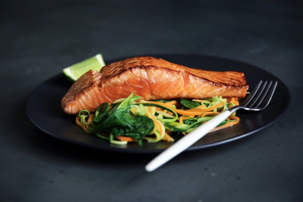 Salmon and vegetables plated for service